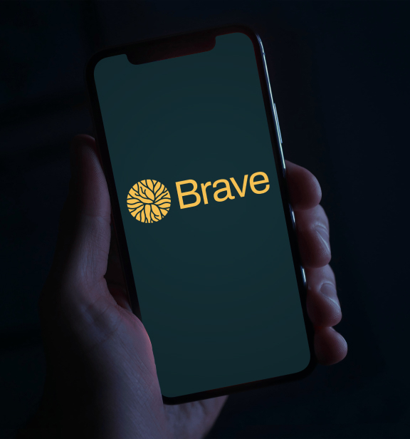 A mobile phone with the Brave app open.